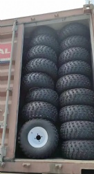 The tires + wheels are assembled into the container